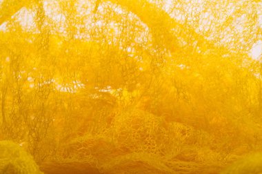 Doku arka planı, desen. Örgü sarı kumaş. Accen için ideal