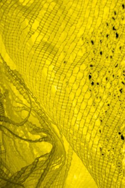 Doku, arka plan, desen. sarı tül. Basit bir tasarıma sahip