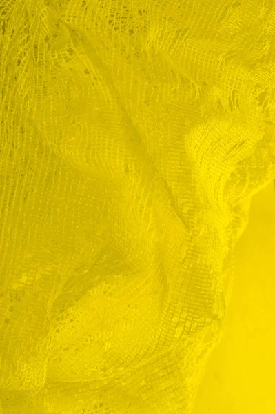 Textura, fundo, padrão. tule amarelo. Com um design simples — Fotografia de Stock