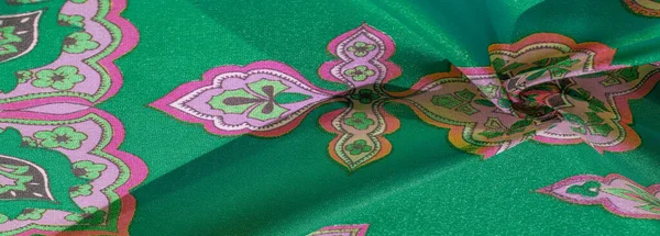 Textura, fundo, tecido de seda multicolorido com um padrão de — Fotografia de Stock