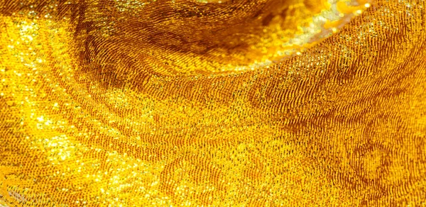 Texture background, pattern. fabric; yellow gold brocade. Organz