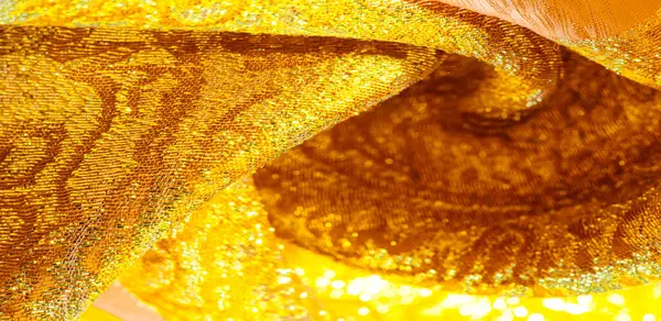 Texture background, pattern. fabric; yellow gold brocade. Organz