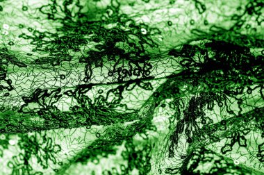 Doku, desen, beyaz bir arka plan üzerinde yeşil dantel kumaş. Th