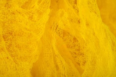 Doku arka planı, desen. Örgü sarı kumaş. Accen için ideal