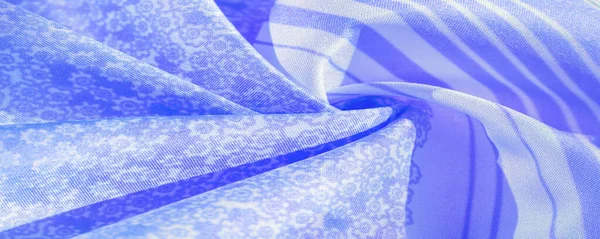 Textura, padrão, tecido de seda azul em um fundo branco, flor — Fotografia de Stock