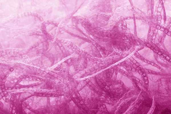 Fabric in a mesh of pink color. this is a micro-thin mesh, which