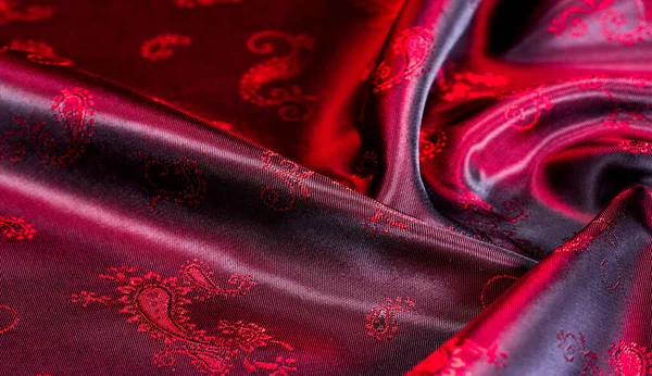 Texture, fabric, red silk with paisley pattern. This beautiful p