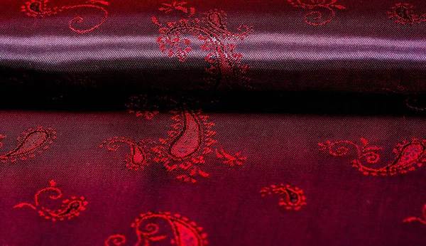 Texture, fabric, red silk with paisley pattern. This beautiful p