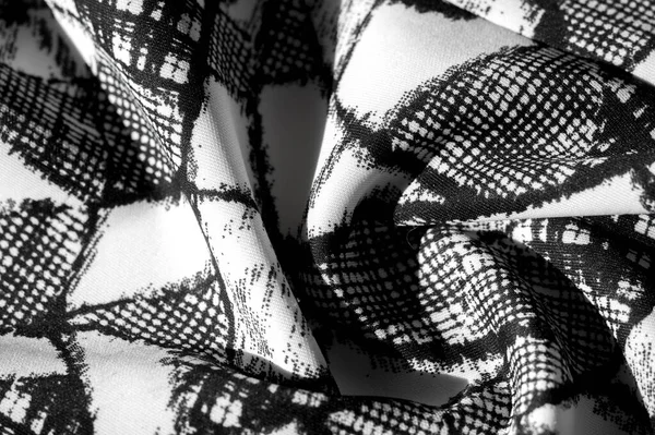 Текстура, фон, узор. белая ткань с черной абстрактной f — стоковое фото