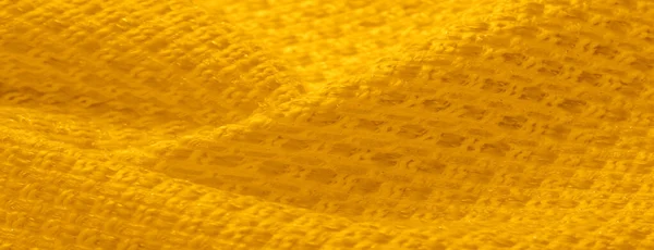 Textura de fundo, padrão. Tecido amarelo com lantejoulas metálicas — Fotografia de Stock