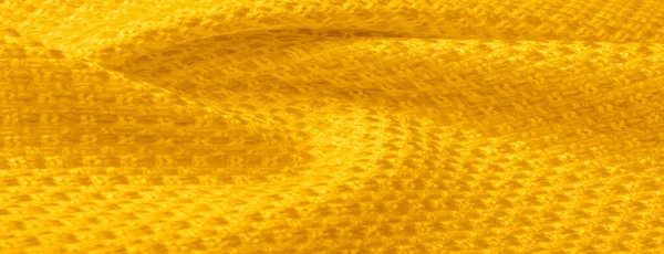 Tekstura tła, wzór. Żółta tkanina z metalowymi cekinami — Zdjęcie stockowe