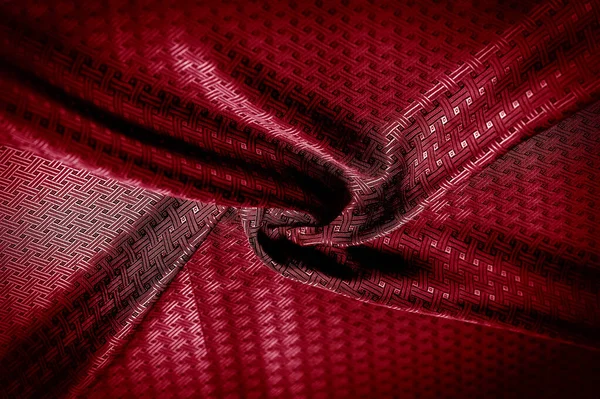 Background texture, pattern. Red silk fabric with a small checkered pattern. A classic look, add this to your designer collection. If you are looking for a red runway, you can learn how to go.