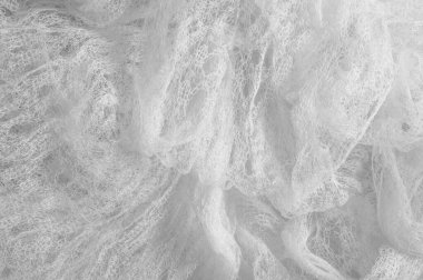 Bir un sayesinde bir örgü doku arka plan deseni beyaz kumaş