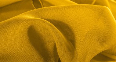 Arka plan, desen, doku, duvar kağıdı, sarı ipek kumaş parlak bir parlaklığa sahip.