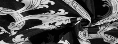 doku, arka plan, monogram desenli siyah ipek kumaş E