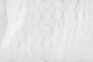 Bir un sayesinde bir örgü doku arka plan deseni beyaz kumaş