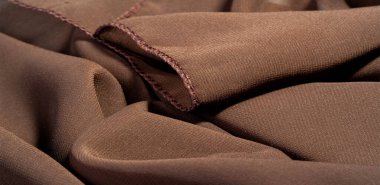 İpek kumaş Arka plan dokusu. Bu doğal kahverengi bir atkı.