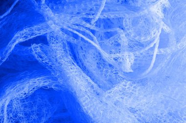 Doku arka planı, desen. bir örgü mavi kumaş, güzel bir 