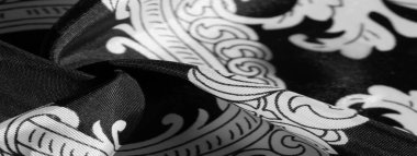 doku, arka plan, monogram desenli siyah ipek kumaş E