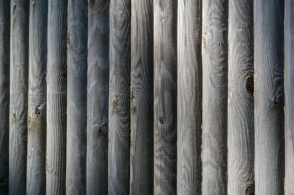 Texture, fond, motif. Clôture de barres en bois, non peintes , — Photo