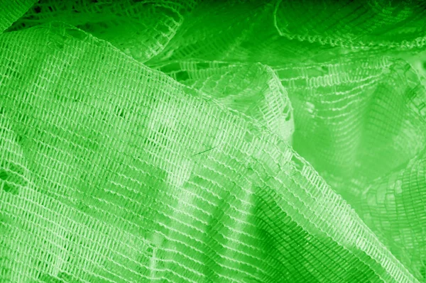 Texture, background, pattern. green tulle. Thin with a heavier w — Stock Photo, Image