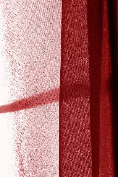 Текстура, фон, рисунок, красная ткань. Элегантные трикотажные материалы — стоковое фото