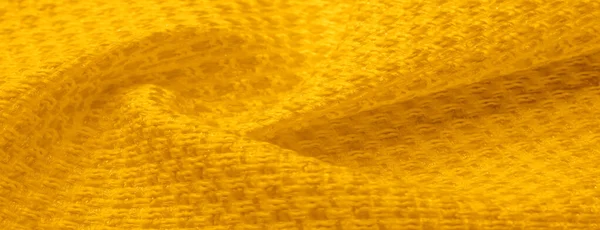 Tekstura tła, wzór. Żółta tkanina z metalowymi cekinami — Zdjęcie stockowe