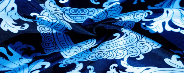 Текстура, фон, чорна шовкова тканина з візерунком монограми E — стокове фото