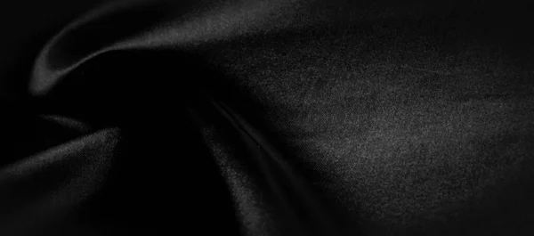 Texture, background, pattern. Black silk fabric. It is black and — Stock Photo, Image