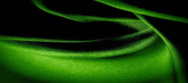 texture, background, pattern. green silk fabric panoramic photo.