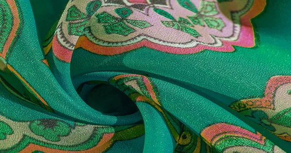 Текстура, фон, різнокольорова шовкова тканина з візерунком — стокове фото