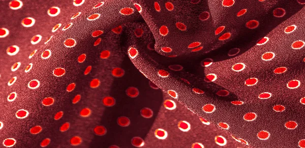 Texture background, pattern, red silk fabric with red polka dots