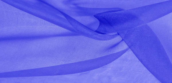 Texture of blue silk fabric. It is also perfect for your design,