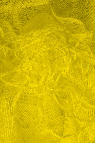 Textura, fundo, padrão. tule amarelo. Com um design simples — Fotografia de Stock