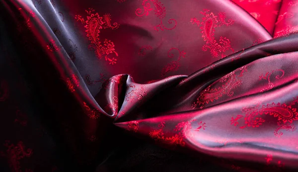 Texture, fabric, red silk with paisley pattern. This beautiful p