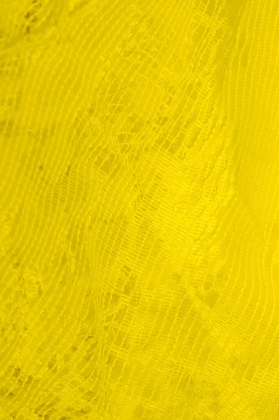 Текстура, фон, візерунок. жовтий тюль. З простим дизайном — стокове фото