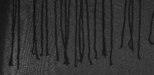 Фон текстуры шелковой ткани. Это натуральный черный шарф. — стоковое фото