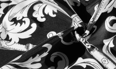 doku, arka plan, monogram desenli siyah ipek kumaş E