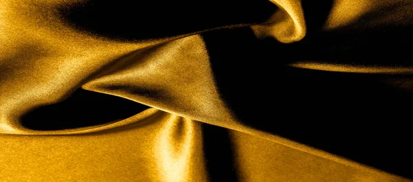 Texture, background, pattern. golden yellow silk fabric panorami — Stock Photo, Image