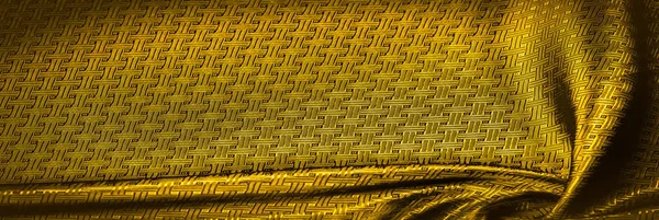 Фоновая текстура, узор. Желтая, горчичная шелковая ткань с — стоковое фото