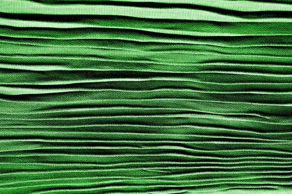 Tekstur, latar belakang, pola, kain sutra berlipatan hijau. Ini... — Stok Foto