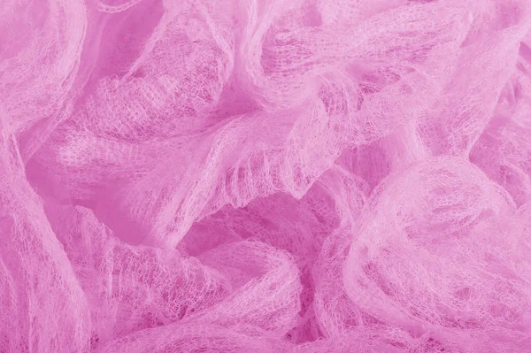 Fabric in a mesh of pink color. this is a micro-thin mesh, which
