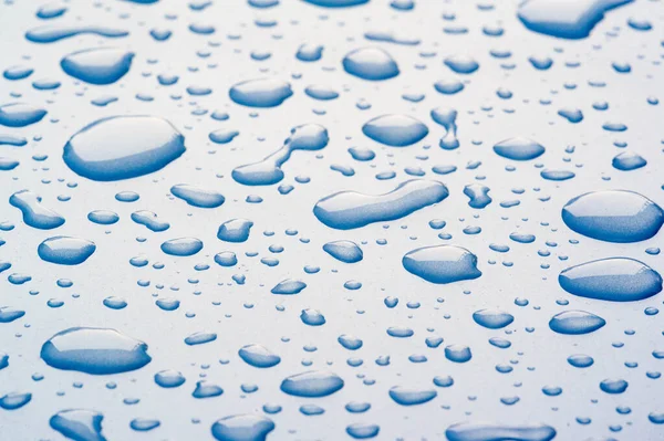 Summer rain, drops of water on the car paint. a small round or p — Stock Photo, Image