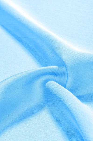 Background, pattern, texture, wallpaper, blue silk fabric. It ha