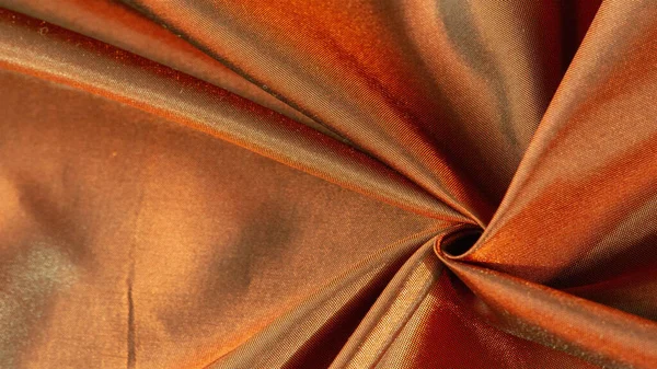texture of postcard background, silk fabric from brown to golden