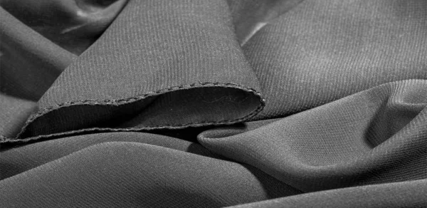 Textura de fondo de tela de seda. Esta es una bufanda negra natural — Foto de Stock