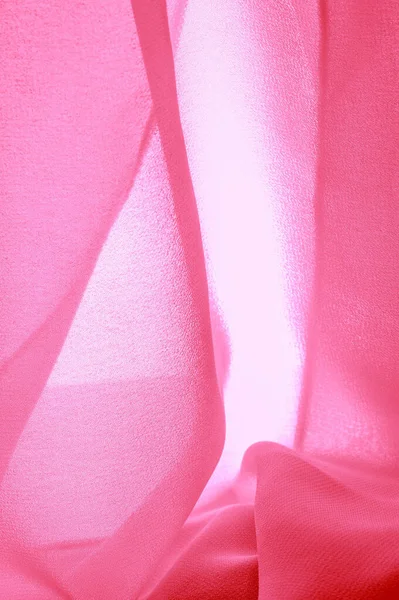Текстура фона. Красная шелковая ткань с тонким матовым покрытием — стоковое фото