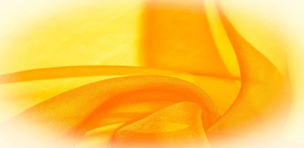 Texture of yellow silk fabric. It is also perfect for your desig