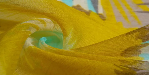 Текстура фона. Шелковая ткань с цветными кружевами. Йелло — стоковое фото