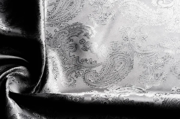 Textura, fondo, tela gris acero negro con un paisley patt — Foto de Stock